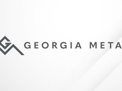 Georgia Metals logo on a clean white background with subtle geometric design accents.
