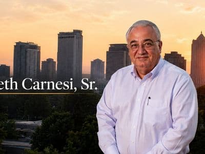 Portrait of Kenneth Carnesi, Sr. in front of a city skyline at sunset, accompanying article about EyeWatch biometric authentication patents.