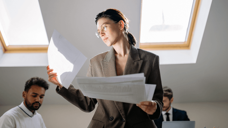 Business leader analyzing brand perception, digital presence, and market positioning, highlighting how visibility, search results, and media shape trust before client engagement.
