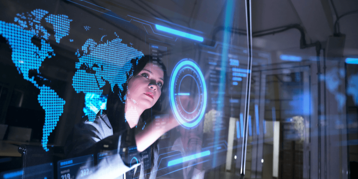 Woman interacting with a digital display featuring global data and analytics