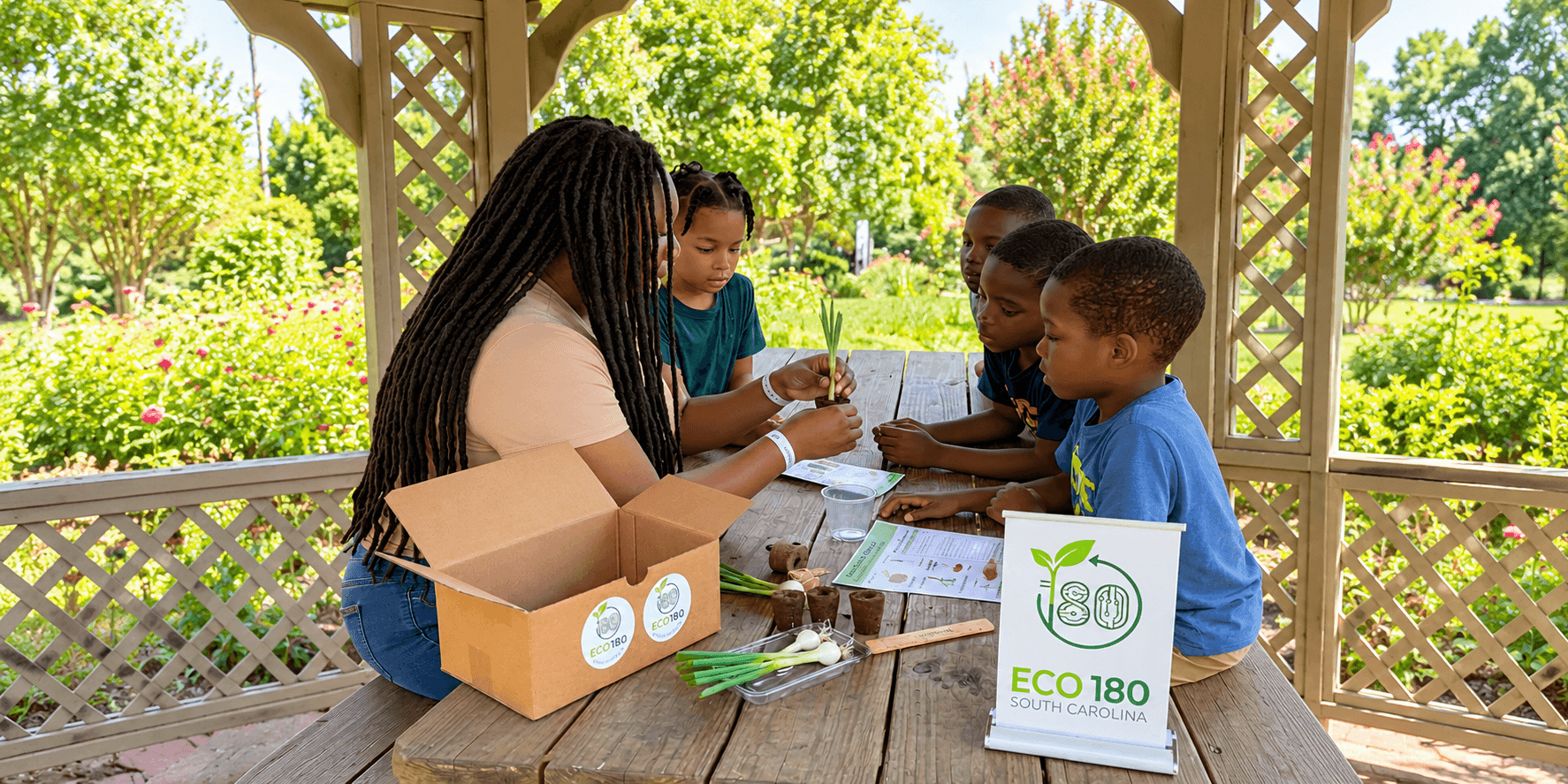 Children and an adult participate in a gardening activity at a gazebo.