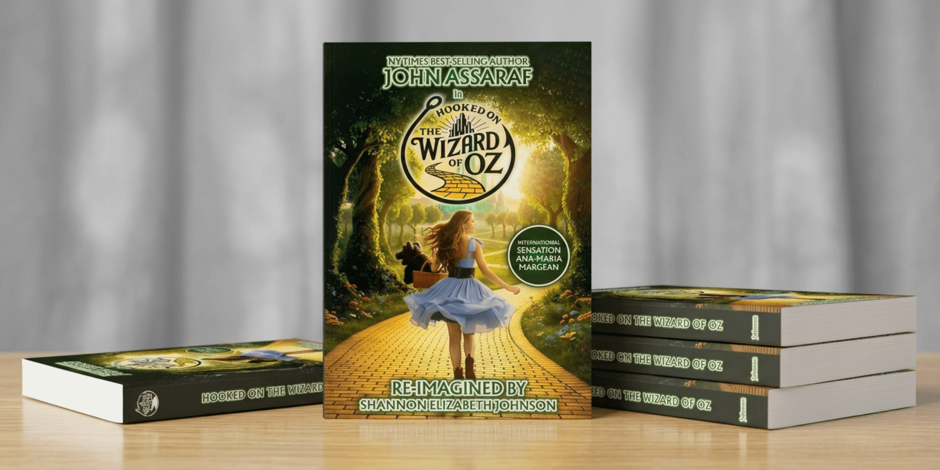 A book titled "Hooked on the Wizard of Oz" by John Assaraf on a table.