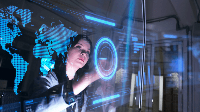 Woman interacting with a digital display featuring global data and analytics