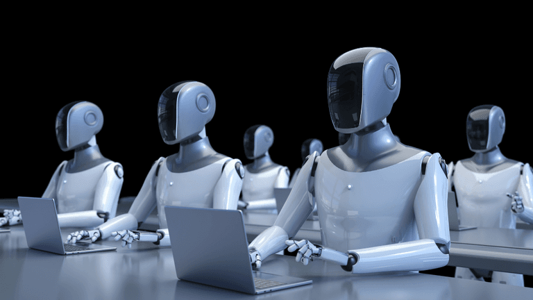 Row of humanoid robots working on laptops in a dark environment