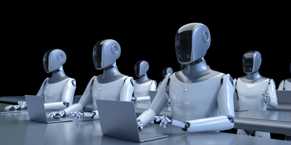 Row of humanoid robots working on laptops in a dark environment