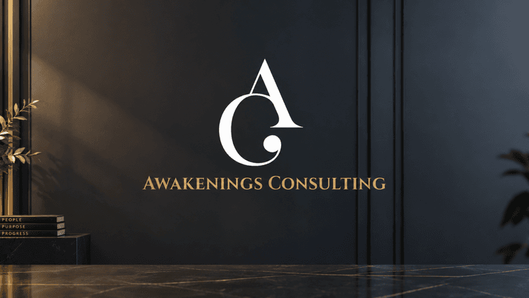 Logo of Awakenings Consulting on a dark wall with decorative plants and books