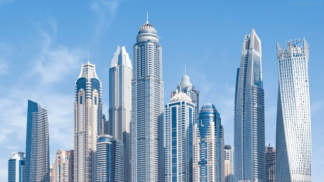 Skyline of modern skyscrapers against a clear blue sky