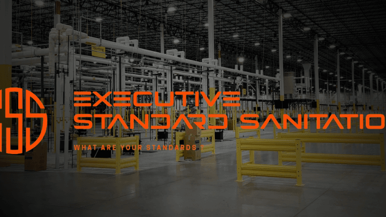 Executive Standard Sanitation logo with warehouse background, emphasizing transparency, integrity, and consistent, client-focused cleaning services with trust.