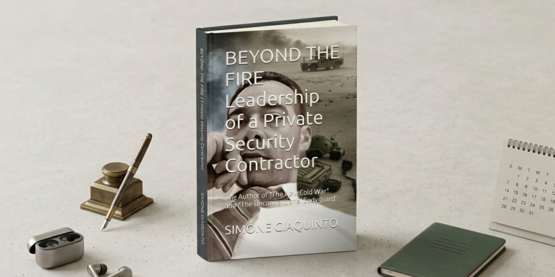 A book titled "Beyond the Fire: Leadership of a Private Security Contractor" stands on a light surface with surrounding office items, conveying professionalism.