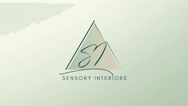 Sensory Interiors logo featuring a minimalist triangle and stylized initials on a light background.